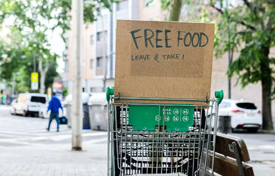 a food card with a sign that reads: FREE FOOD
